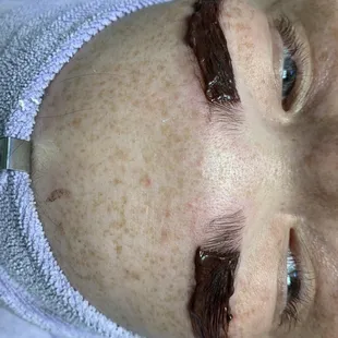 Brow tint in progress