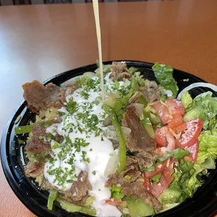 Some good ole sauce I forgot the name of :( but I do remember it came with the salad, so ask for it!!!