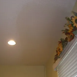 ceiling water damage . drywall repair done right very good texture match