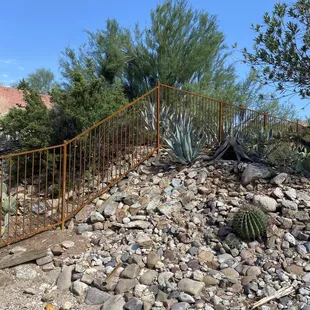 Wrought iron fencing on a decline