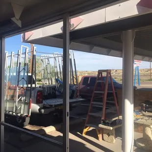 Installing glass for broken windows at a restaurant