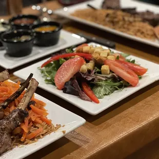 three plates of food on a table