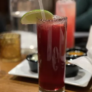 a drink with a lime slice on the rim