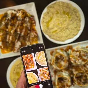 a person taking a picture of their food