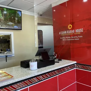 a counter with a laptop on it