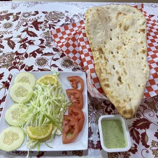 Salad, sauce, and flat bread