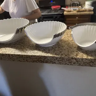 Broken bowls with out the pieces that fell off