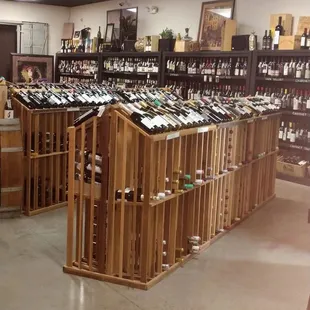 rows of wine bottles in a wine shop