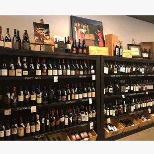 a large selection of wine bottles