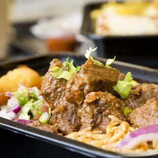 a plate of beef and rice