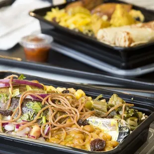 two trays of food on a table