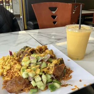 Jollof rice, lamb, mixed veggies, corn, plantains, and kachumbari, with Afra fantastic sauce