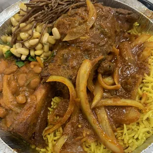 Lamb shank, East African rice, beans/corn/noodles.