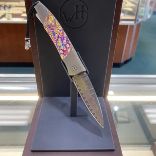 William Henry titanium burl damascus knife