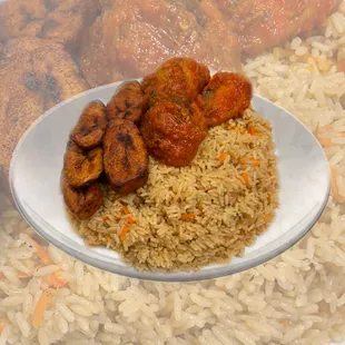 Coconut Rice served with plantains, beef and chicken.