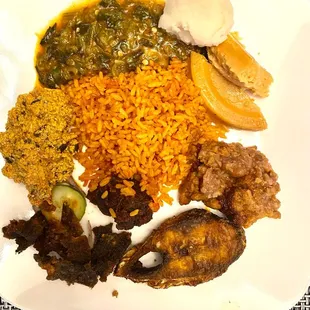 Naija spread - including a piece of hilsa fish that my mother fried