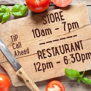 a cutting board with a knife and tomatoes