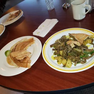 A Somali Breakfast... Notice no silverware.   Liver, onions, potatoes?? AMAZING