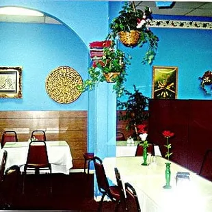 a dining room with blue walls