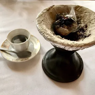 a cup of coffee with a spoon in it