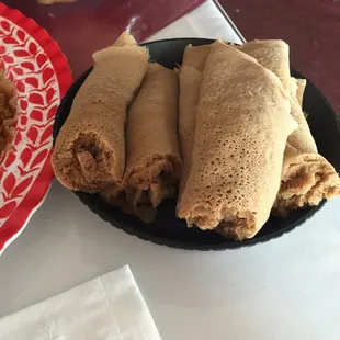 Injera and Doro Wat, split peas, spicy lentils, and lamb tibs.