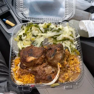 Jerk chicken, yollof rice and mixed greens