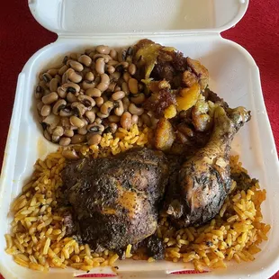 Jerk chicken plate with baked beans and plantains