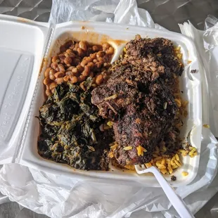 Jerk Chicken, white meat, black eyed peas, spinach, jollof rice