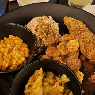 Curry Shrimp plate with fried catfish,  smothered cabbage &amp; corn maque choux. So freaking good!