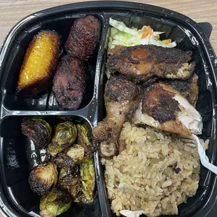 Jerk chicken plate with rice and peas, brussel sprouts and plantains