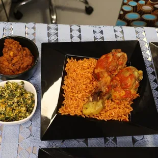 a plate of rice with meat and vegetables