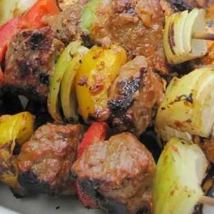 skewers of meat and vegetables on a plate