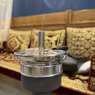 smoke coming out of a hookah