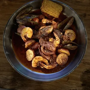 a bowl of clams and corn