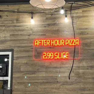 a neon sign on the wall