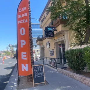 a closed sign on the sidewalk