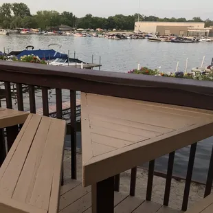 Cool triangle tables so both people are facing the water