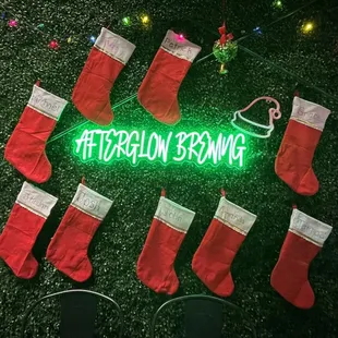 a neon sign surrounded by stockings