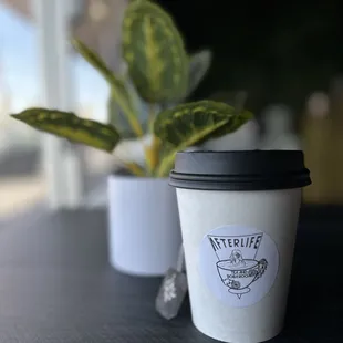 a cup of coffee on a table