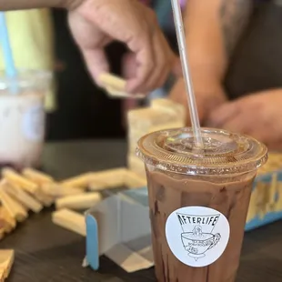 a cup of coffee with a straw