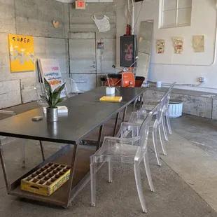 a table and chairs in a warehouse