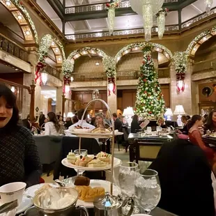 a woman sitting at a table in a restaurant