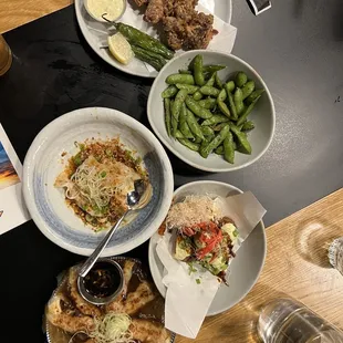 In descending order of the picture: Karaage, edamame, spicy crispy gyoza, takoyaki, winged buta gyoza