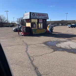a coffee stand in a parking lot