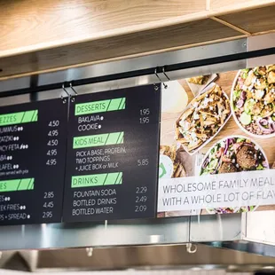 a menu board with a variety of food items