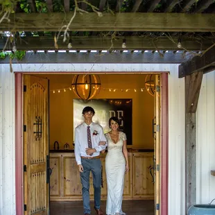 My handsome son walked me down the aisle. The wooden doors provide quite the grand entrance.