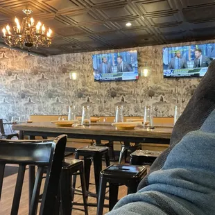 a person's feet in a restaurant