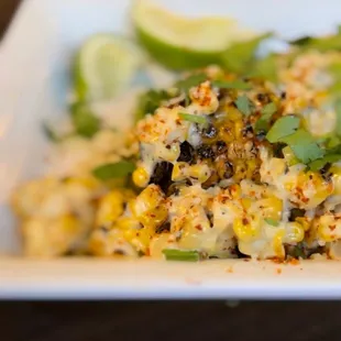 a plate of corn and vegetables
