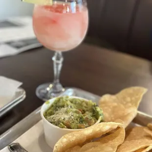 a plate of chips and a drink