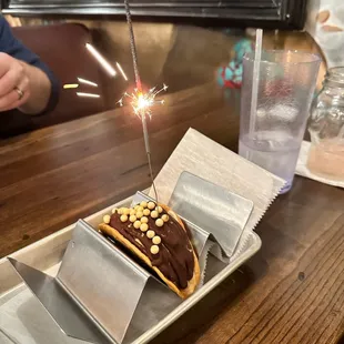 a chocolate dessert with a sparkler